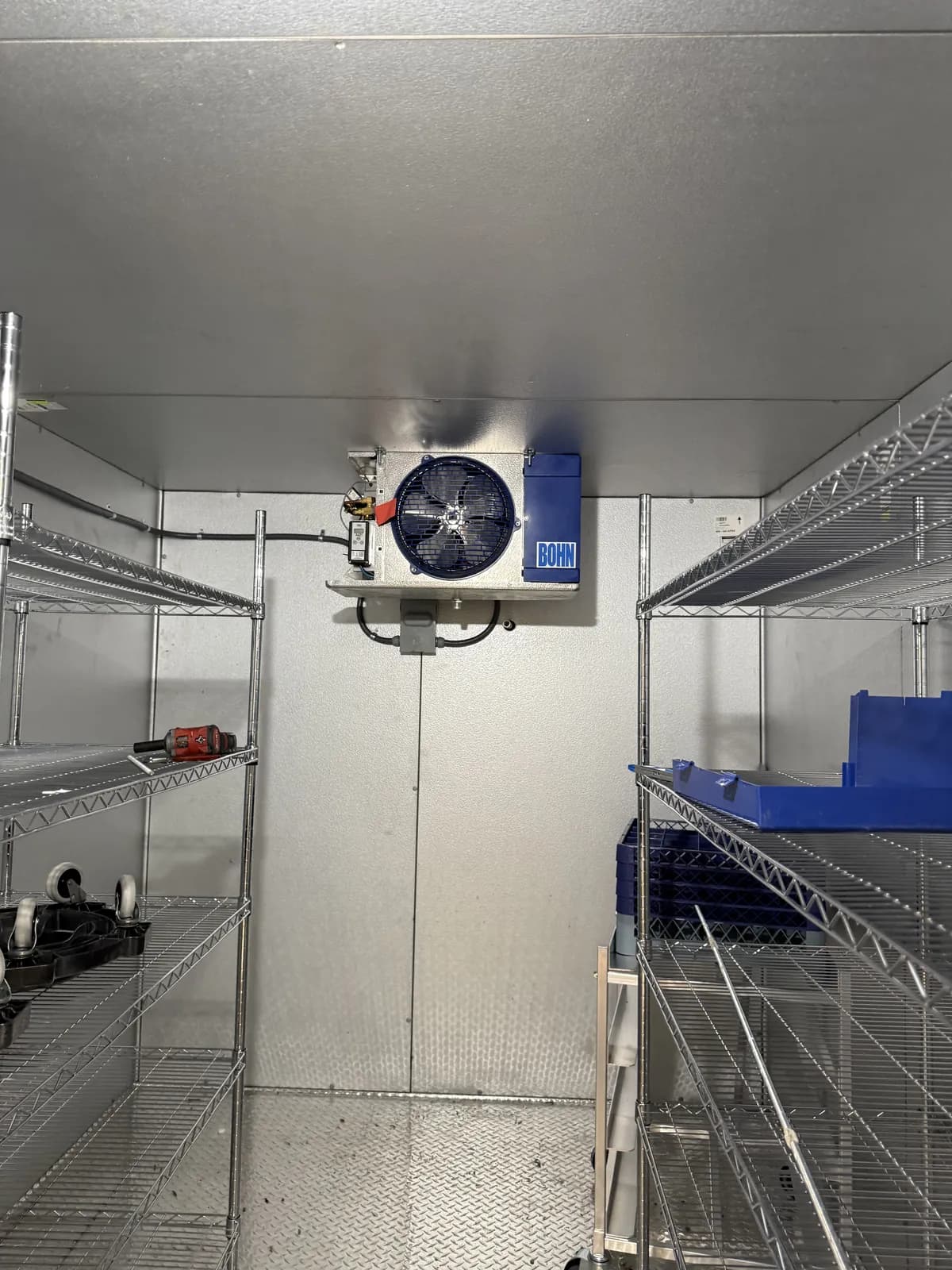 A Bohn evaporator coil unit mounted inside a commercial walk-in cooler